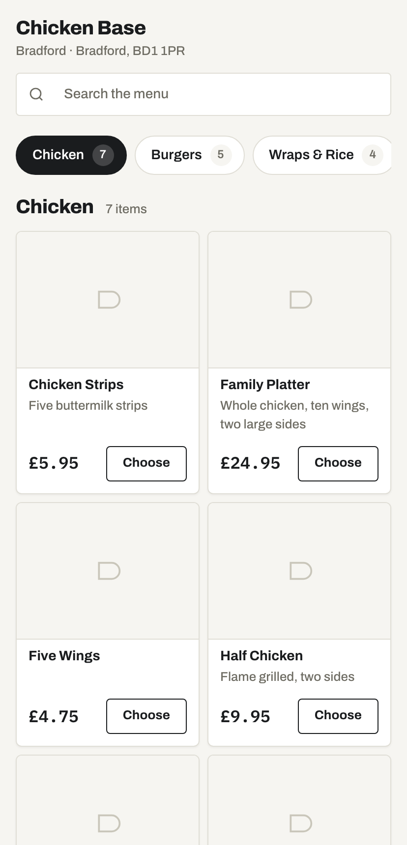 A shop's own ordering page on a phone, with photo cards and a basket.
